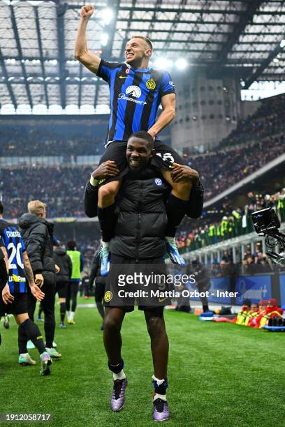 Davide Frattesi of FC Internazionale celebrates with teammate Marcus Thuram after scoring their team's second goal during the Serie A TIM match...