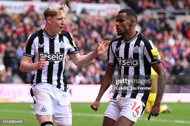 Alexander Isak of Newcastle United celebrates with Anthony Gordon after scoring his team's second goal during the Emirates FA Cup Third Round match...