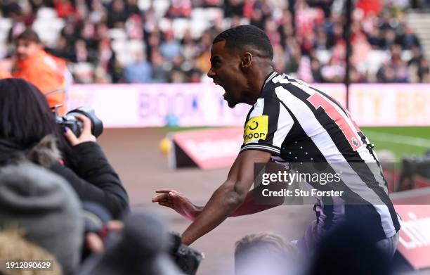 Alexander Isak of Newcastle United celebrates with the fans after scoring his team's second goal during the Emirates FA Cup Third Round match between...