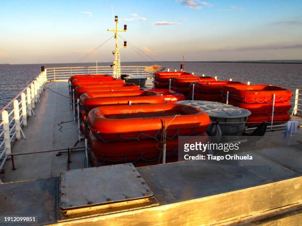 lifeboats on a boat sailing the amazon river - molhado stock pictures, royalty-free photos & images