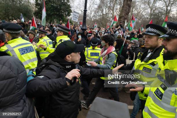 Police scuffle with protesters at St James Park as over a thousand people attend the Palestine protest called by Sisters Uncut and others on January...