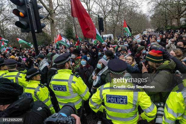 Police scuffle with protesters at St James Park as over a thousand people attend the Palestine protest called by Sisters Uncut and others on January...