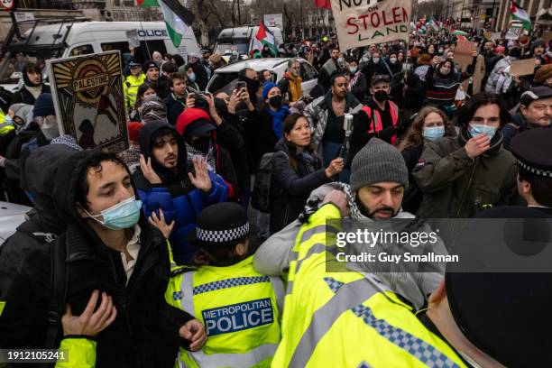 Police scuffle with protesters next to Parliament as over a thousand people attend the Palestine protest called by Sisters Uncut and others on...