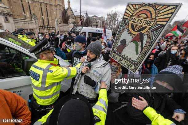 Police scuffle with protesters next to Parliament as over a thousand people attend the Palestine protest called by Sisters Uncut and others on...