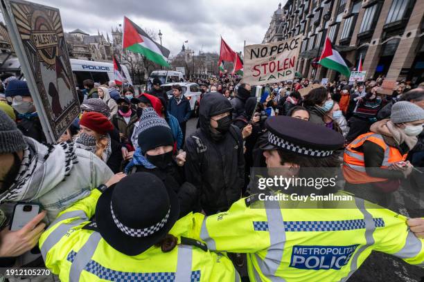 Police scuffle with protesters next to Parliament as over a thousand people attend the Palestine protest called by Sisters Uncut and others on...