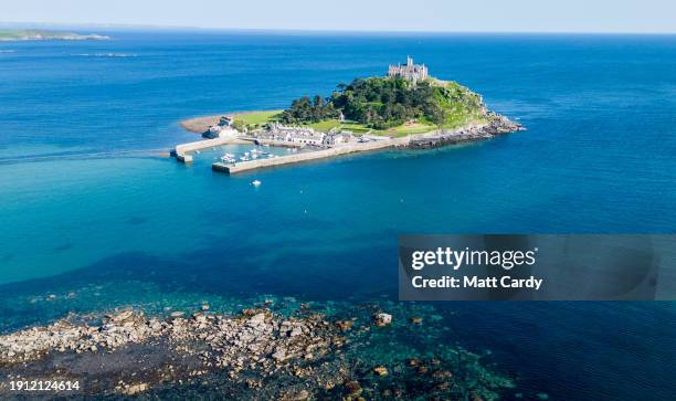 The sea surrounds the historic castle and settlement at St Michael's Mount on May 31, 2023 in Cornwall, England. The county of Cornwall, in the south...