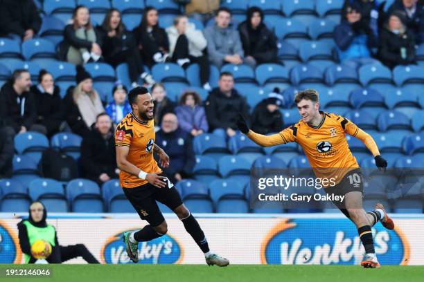Jack Lankester of Cambridge United celebrates scoring his team's first goal during the Emirates FA Cup Third Round match between Blackburn Rovers and...