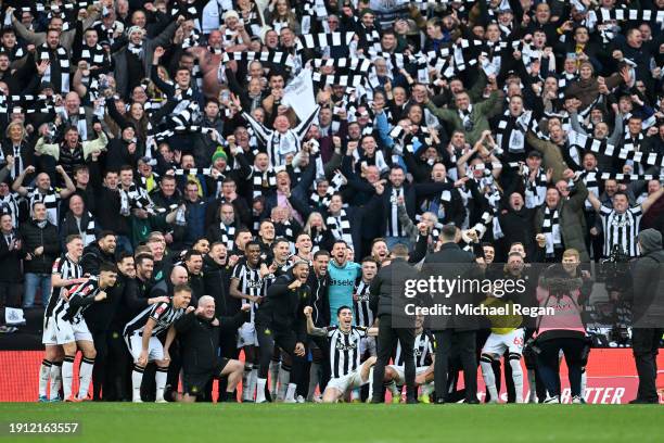 Newcastle United fans celebrate with the players after the team's victory during the Emirates FA Cup Third Round match between Sunderland and...