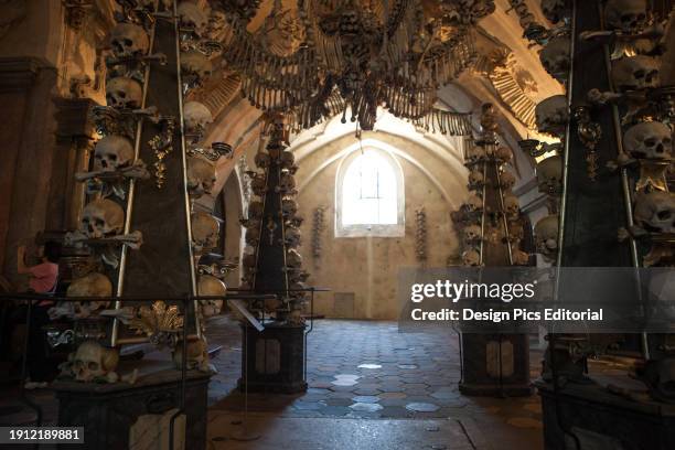 Human skulls and bones in The Bone Church, or Sedlec Ossuary, in Kutna Hora. Kutna Hora, Czech Republic.