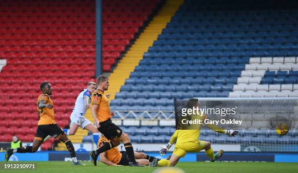 Sammie Szmodics of Blackburn Rovers scores his team's second goal past Jack Stevens of Cambridge United during the Emirates FA Cup Third Round match...