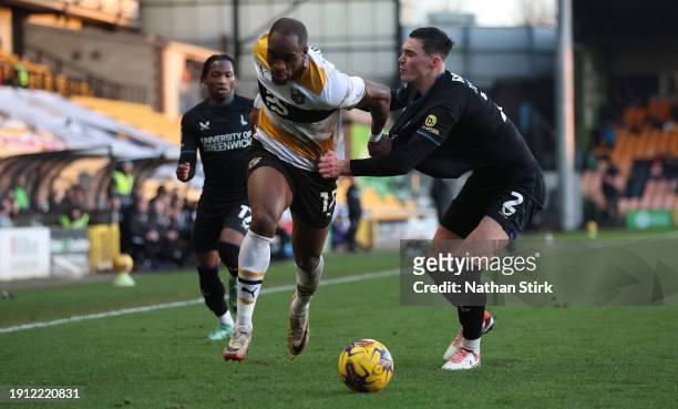 Uche Ikpeazu of Port Vale runs past of Charlton Athletic during the Sky Bet League One match between Port Vale and Charlton Athletic at Vale Park on...