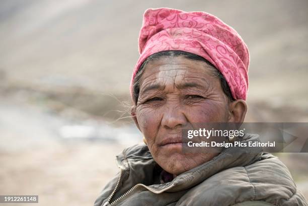 Pilgrim resting on the Kora pilgrimage at Mount Kailash. Tibetan Autonomous Region, Tibet.