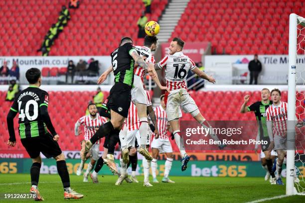 Lewis Dunk of Brighton & Hove Albion scores his team's second goal during the Emirates FA Cup Third Round match between Stoke City and Brighton and...