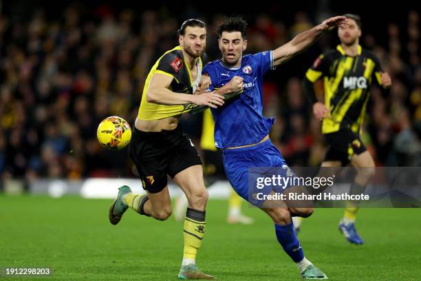 Wesley Hoedt of Watford and Joe Quigley of Chesterfield battles for possession with during the Emirates FA Cup Third Round match between Watford and...