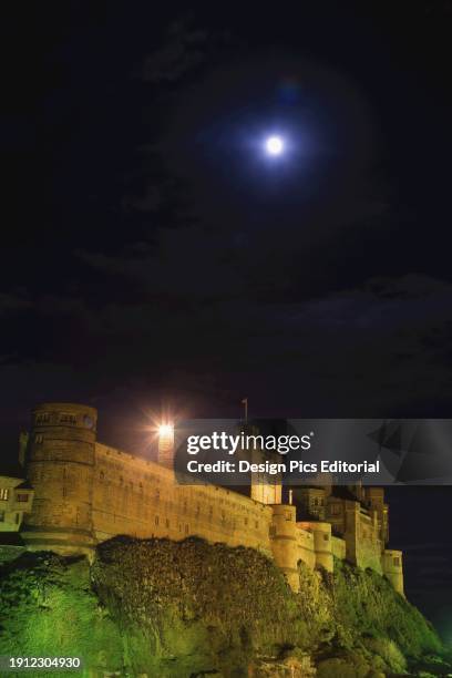 Bright Moonlight Over Bamburgh Castle. Bamburgh, Northumberland, England.