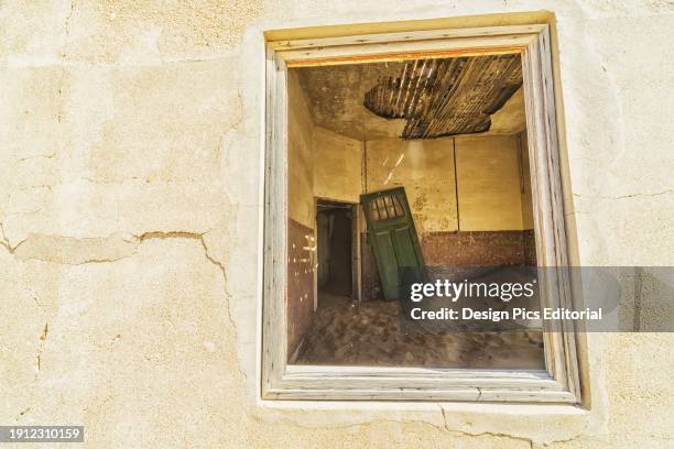 Sand In The Rooms Of A Colourful And Abandoned House. Kolmanskop, Namibia.