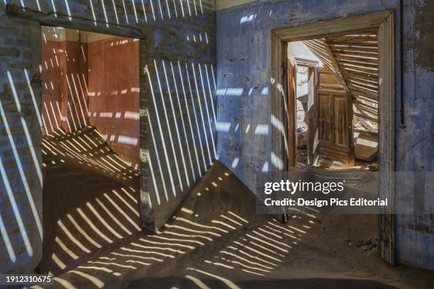 Sand In The Rooms Of A Colourful And Abandoned House. Kolmanskop, Namibia.