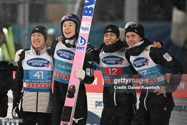 Ryoyu Kobayashi of Japan reacts alongside Junshiro Kobayashi of Japan, Ren Nikaido of Japan and Taku Takeuchi of Japan after competing in the Second...