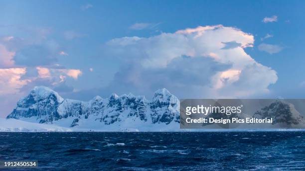 Mountains, ice and snow along the Gerlache Strait in Western Antarctica. Antarctica.