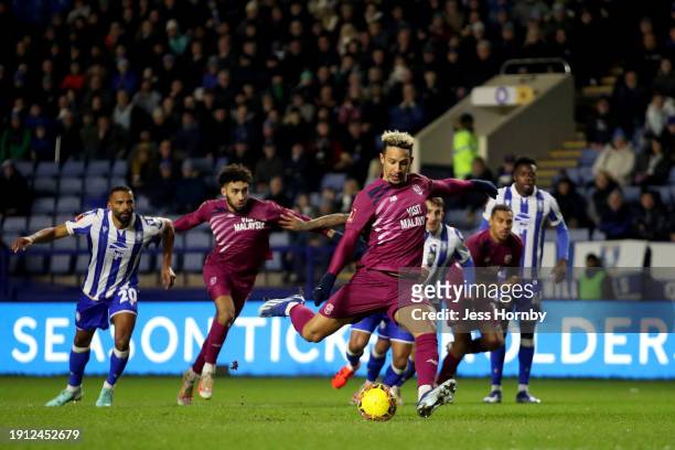 Cameron Dawson of Sheffield Wednesday saves the penalty of Callum Robinson of Cardiff City during the Emirates FA Cup Third Round match between...