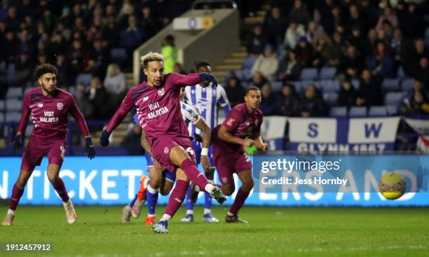 Cameron Dawson of Sheffield Wednesday saves the penalty of Callum Robinson of Cardiff City during the Emirates FA Cup Third Round match between...