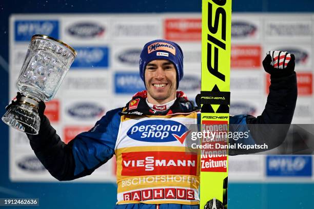 First Place, Stefan Kraft of Austria celebrates with his trophy during the Victory Ceremony after competing in the FIS World Cup Ski Jumping Four...