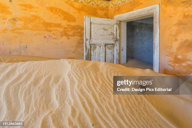 Sand In The Rooms Of A Colourful And Abandoned House. Kolmanskop, Namibia.