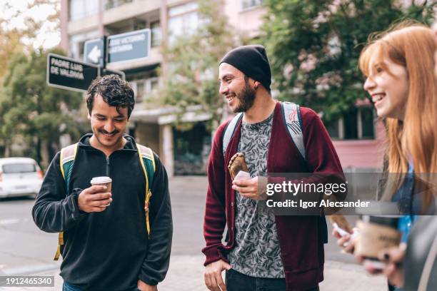 young people on the way having a snack in the city - chilean people stock pictures, royalty-free photos & images