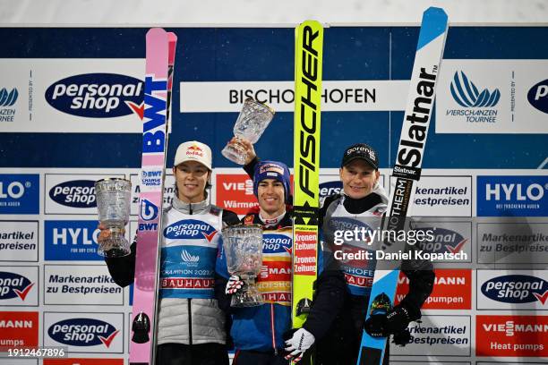 Second Place, Ryoyu Kobayashi of Japan, First Place, Stefan Kraft of Austria and Third Place, Anze Lanisek of Slovenia, pose for a photo with their...