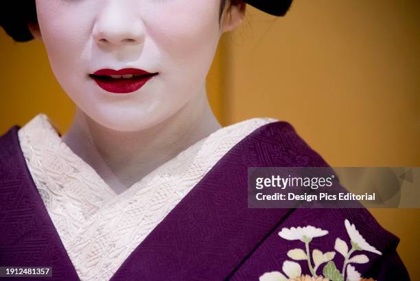 Portrait of a Maiko, an apprentice geisha in Kyoto and Western Japan. Their jobs consist of performing songs, dances, and playing the shamisen or...
