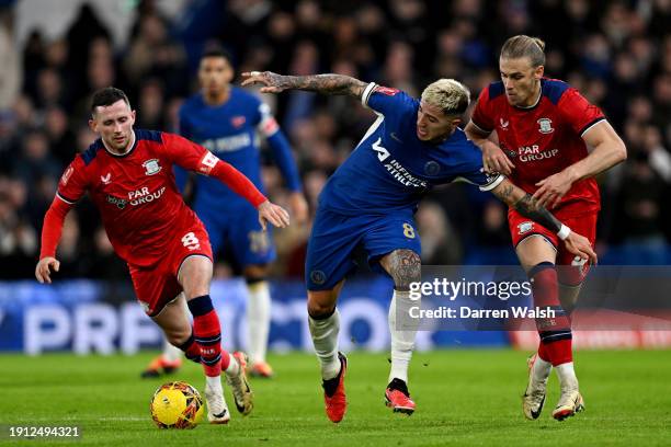 Enzo Fernandez of Chelsea is challenged by Brad Potts and Alan Browne of Preston North End during the Emirates FA Cup Third Round match between...