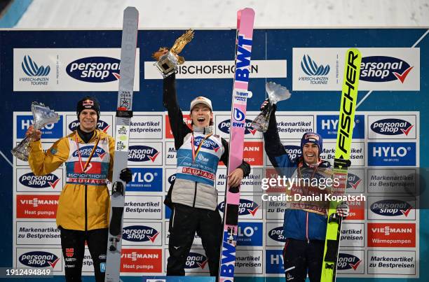 Second Place, Andreas Wellinger of Germany, First Place, Ryoyu Kobayashi of Japan and Third Place, Stefan Kraft of Austria celebrate with their...