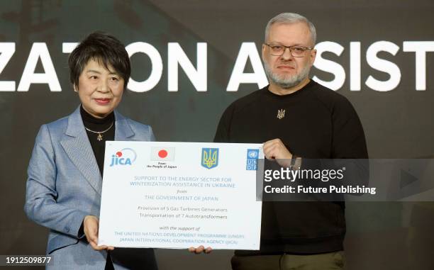 Minister of Foreign Affairs of Japan Yoko Kamikawa and Minister of Energy of Ukraine German Galushchenko pose for a photo during the ceremony to...