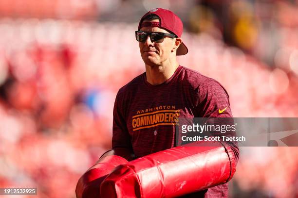 Assistant defensive line coach Ryan Kerrigan looks on before the game against the San Francisco 49ers at FedExField on December 31, 2023 in Landover,...