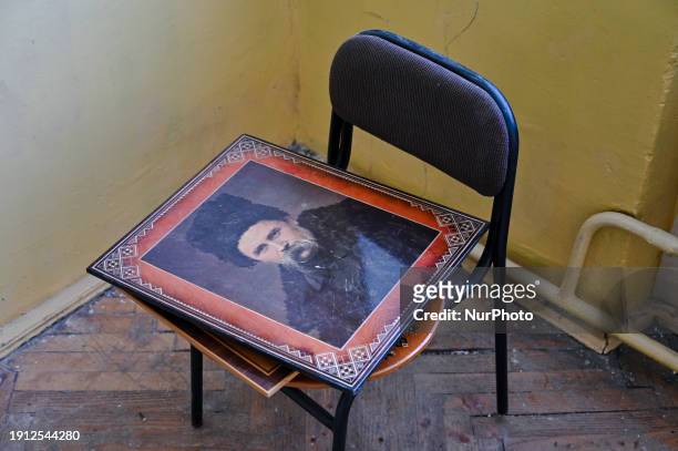 Portrait of Taras Shevchenko is lying on a chair in the corridor of the Oriiana Lyceum in Lviv, Ukraine, on January 8 where a Russian missile strike...