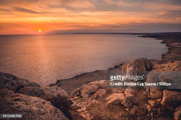scenic view of sea against sky during sunset,larnaca,cyprus - larnaca stock pictures, royalty-free photos & images