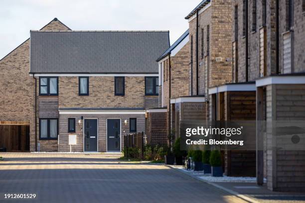 Completed houses at a Persimmon Plc residential property construction site in Colchester, UK, on Tuesday, Jan. 9, 2024. Easing mortgage rates are...