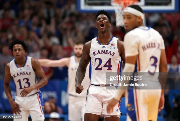 Adams Jr. #24 of the Kansas Jayhawks reacts after dunking during the 1st half of the game against the TCU Horned Frogs at Allen Fieldhouse on January...