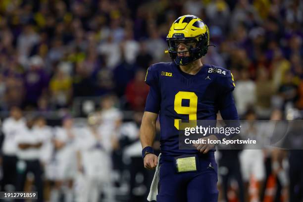 Michigan Wolverines quarterback J.J. McCarthy looks to the sideline for the play call during the CFP National Championship game Michigan Wolverines...