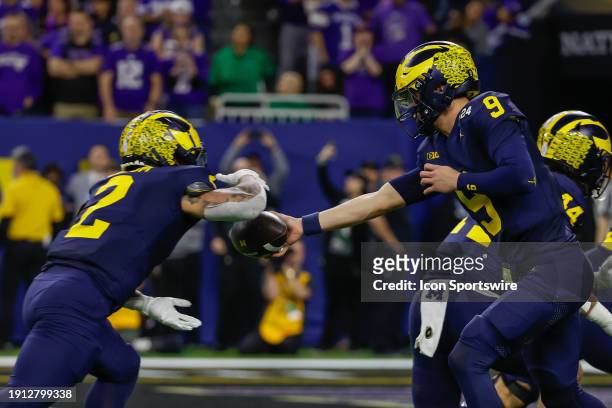 Michigan Wolverines quarterback J.J. McCarthy hands the ball off to Michigan Wolverines running back Blake Corum who runs for a touchdown during the...