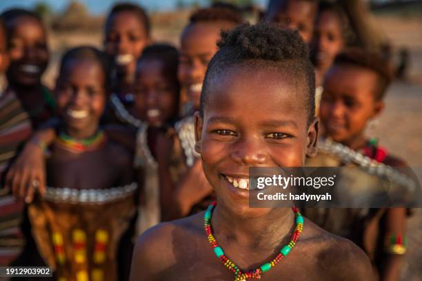 group of happy african children from hamer tribe, east africa - hamar stock-fotos und bilder