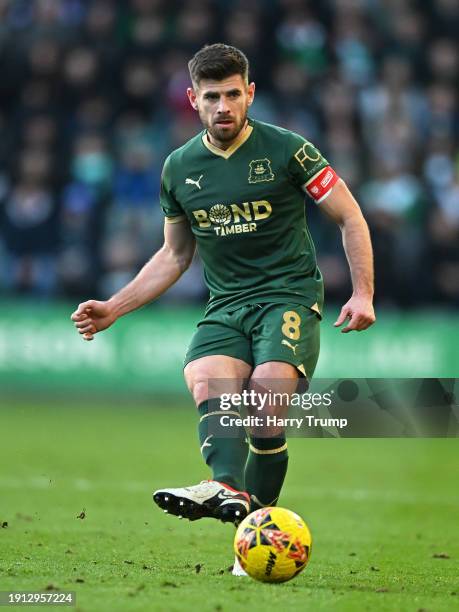 Joe Edwards of Plymouth Argyle looks for a pass during the Emirates FA Cup Third Round match between Plymouth Argyle and Sutton United at Home Park...