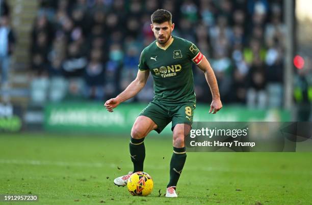 Joe Edwards of Plymouth Argyle looks for a pass during the Emirates FA Cup Third Round match between Plymouth Argyle and Sutton United at Home Park...