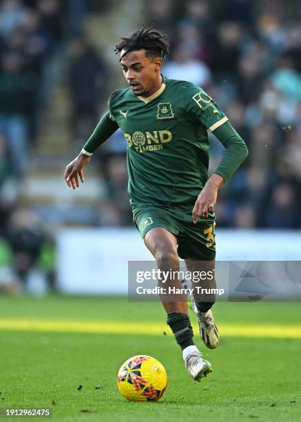 Freddie Issaka of Plymouth Argyle runs with the ball during the Emirates FA Cup Third Round match between Plymouth Argyle and Sutton United at Home...