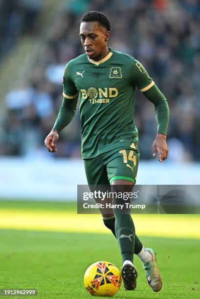 Mickel Miller of Plymouth Argyle runs with the ball during the Emirates FA Cup Third Round match between Plymouth Argyle and Sutton United at Home...