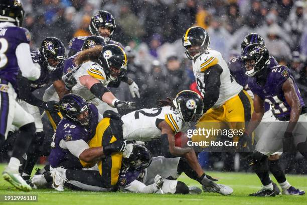 Najee Harris of the Pittsburgh Steelers is tackled by Travis Jones of the Baltimore Ravens in the first quarter of a game at M&T Bank Stadium on...