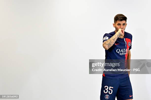 Lucas Beraldo poses for a photoshoot after signing a 5 year contract with Paris Saint-Germain at Campus PSG on January 01, 2024 in Paris, France.