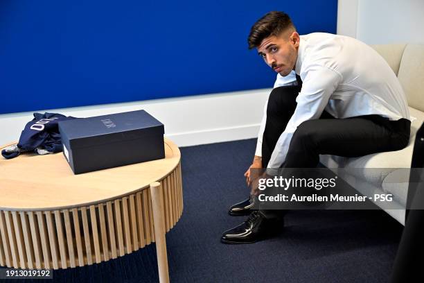 Lucas Beraldo tries on a suit after signing a 5 year contract with Paris Saint-Germain at Campus PSG on January 01, 2024 in Paris, France.