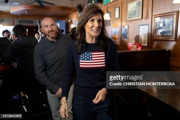 Former US ambassador to the United Nations and 2024 Republican presidential hopeful Nikki Haley departs a campaign stop at Mickey's Irish Pub in...