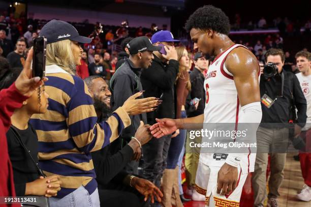 Bronny James of the USC Trojans greets parents LeBron James of the Los Angeles Lakers and Savannah James after the game against the Stanford Cardinal...